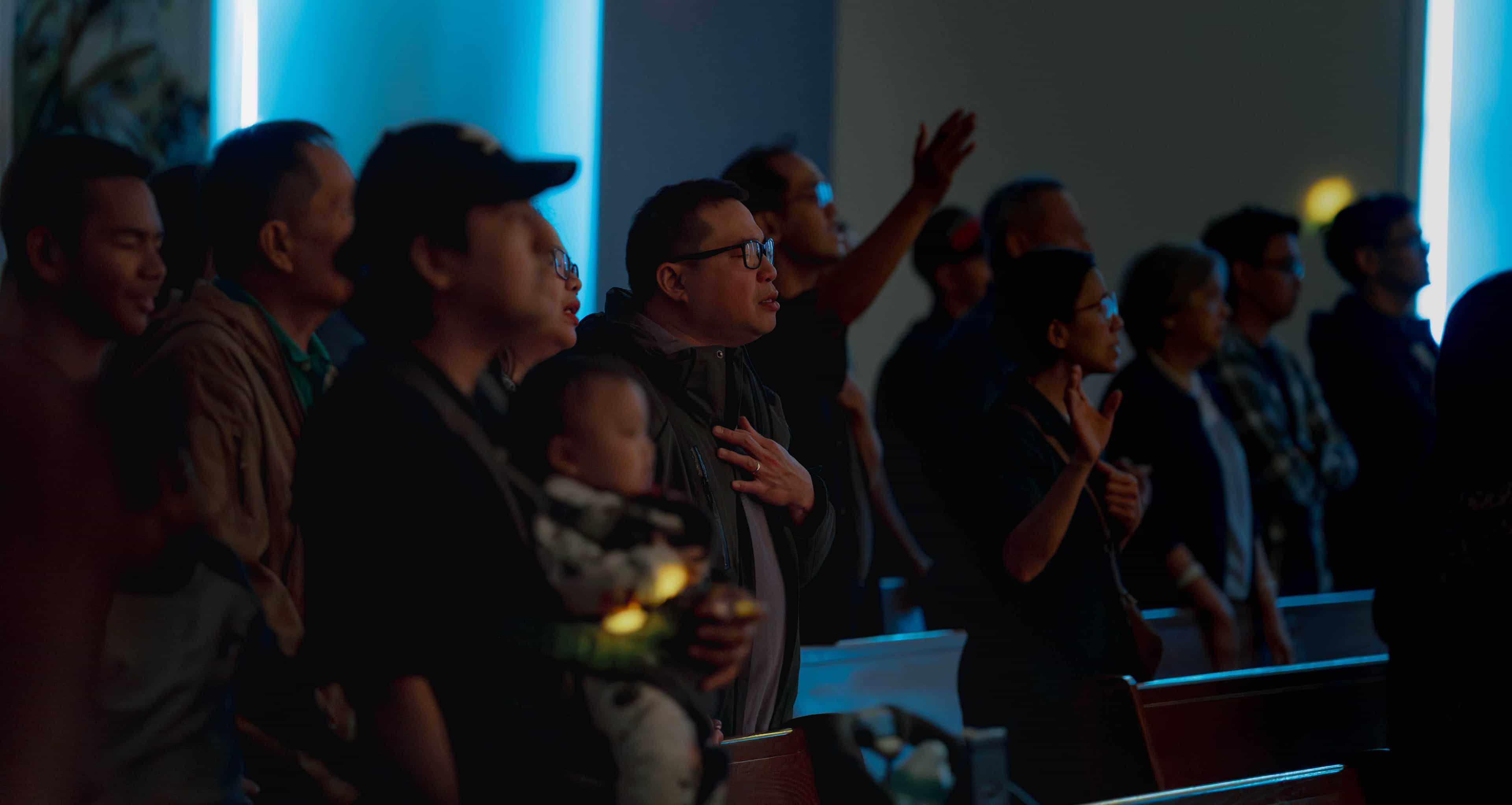 People gathered at Life Community Church, Edmonton, smiling and connecting.